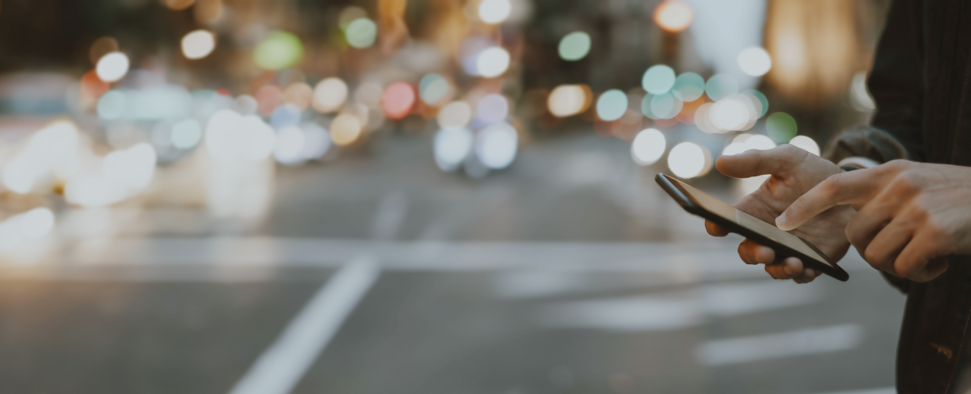 person using smartphone in city